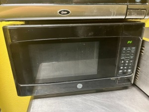 ASSORTED SMALL APPLIANCES - 1- GE MICROWAVE / 1- OSTER MICROWAVE / 1- OSTER 2-SLICE TOASTER