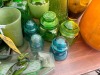 GREEN GLASS POURERS, MUGS, VASES, ETC - 8