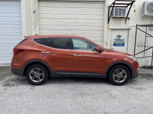 2017 HYUNDAI SANTA FE - VIN #5XYZT3LBXHG450578- ORANGE - CLOTH INTERIOR - KEYLESS ENTRY - 114,045 MILES ON ODOMETER (CASE #24-11284-LMI / ERNESTO SANTOS CACHAN / MARIA YIP, TRUSTEE) ***LOCATED IN DAVIE, FL***