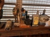 ASSORTED TABLE DECOR - 1- FLASK / 4- LIQUOR DECANTERS / 1- LOT OF GUN POWDER CANS / 1- INDIAN SQUAW WITH PAPOOSE