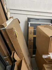 ASSORTED HURRICANE WINDOWS (3 STACKS ON SOUTH WALL)