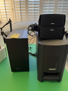 SPEAKERS - 1- BOSE SUBWOOFER / 2- BOSE SPEAKERS / 1- SAMSUNG SPEAKER WITH REMOTE