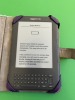 KINDLE D00901 IN PURPLE CASE WITH LIGHT