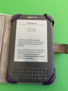 KINDLE D00901 IN PURPLE CASE WITH LIGHT