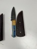 ASSORTED SKINNING KNIVES - CUSTOM HANDMADE DAMASCUS STEEL - PAKKA WOOD HANDLE - LAMINATED LEATHER SHEATH (RED HANDLE HAS SMALL FLAW) - 2