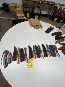 ASSORTED KNIVES - 4- 4'' HUNTING & SKINNING / 2- BULL CUTTING / 1- ALASKAN ULU - CUSTOM HANDMADE DAMASCUS STEEL - TEXAS FLAG RESIN HANDLE - LAMINATED LEATHER SHEATH