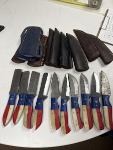 ASSORTED KNIVES - 6- ASSORTED LENGTH HUNTING & SKINNING / 4- 4'' BULL CUTTING - CUSTOM HANDMADE DAMASCUS STEEL - TEXAS PAKKA WOOD & RESIN HANDLE - LAMINATED LEATHER SHEATH