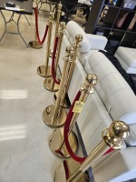 GOLD STANCHIONS WITH RED VELVET CORDS
