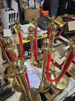 GOLD STANCHIONS WITH RED VELVET ROPES