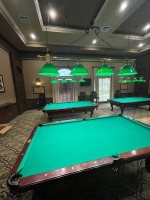 BRASS BAR HANGING LIGHTS WITH 4 LIGHTS WITH GREEN GLASS SHADES ***TO BE REMOVED BY MAINTENANCE DEPARTMENT***