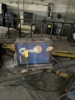 ASSORTED PIECES - 1- MILLER WELDER / 5- WELDING ARMS WITH MILLER FEEDERS