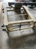 YELLOW ACCORDION LIFT ON WHEELS