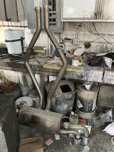 LOT ASSORTED - BALANCE OF FLOOR LEVEL NOT LOTTED - LARGE QUANTITY METAL / STEEL / ALUMINUM, CAR PARTS, GEARS, CHAINS, HOMEMADE SPRAY BOOTH STANDS, HOODS, EXHAUST, DOORS, ETC