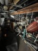 LOT ASSORTED - BACK LOFT SECTION - 18' METAL TABLE, ALUMINUM LADDER, GENERATOR, AUTOMOTIVE DOORS, METAL BEAMS, TABLE FOR TABLE SAW, CAR PARTS, BUMPERS, LIGHTS, METAL RACKS, PRESSURE WASHER, FAN, HOISTS, TOOL BOX, TIRES, ETC ***MUST HAVE FORKLIFT*** - 4