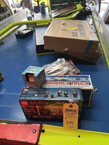 ASSORTED TOYS - 1- STAR WARS PUZZLE / 1- HESS TRUCK (DAMAGED) / 1- HARRY POTTER LEGO / 1- CHATTERING TEETH