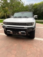 2025 GMC HUMMER EV 3X - VIN #1GT40DDBXSU119643 - White Exterior - Electric Vehicle - 4 Door Crew Cab - Leather Interior - Heated Seats - Rear A/C - Keyless Entry - Sun Roof - Navigation System - Bed Liner - Bed Cover - 20,786 Miles on Odometer - (Located 