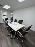 WHITE CONFERENCE TABLE WITH 6 BROWN ROLLING CHAIRS - APPROXIMATELY 78''x38''