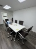 WHITE CONFERENCE TABLE WITH 6 BROWN ROLLING CHAIRS - APPROXIMATELY 78''x38''