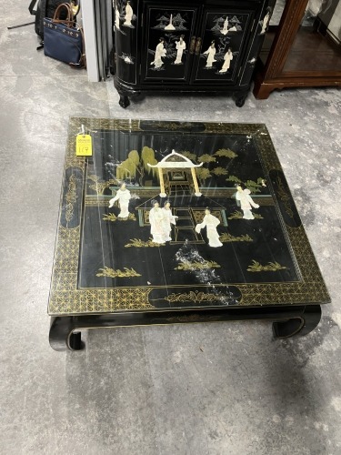 ORIENTAL BLACK LACQUER COFFEE TABLE WITH RAISED FIGURES & GLASS TOP - 3'x3'