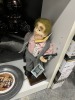 ASSORTED PIECES - DOLL ON STAND / BOX BOEING KEYCHAINS / PEWTER 1776 PLATE / LUCKY CLOVER PLATE - 6
