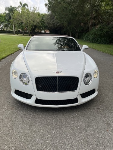 2014 BENTLEY CONTINENTAL GT CONVERTIBLE - VIN #SCBGT3ZA7EC092204 - WHITE EXTERIOR - AUTOMATIC TRANSMISSION - V8 ENGINE - LEATHER INTERIOR - NAVIGATION SYSTEM - HEATED SEATS - KEYLESS ENTRY - 19,716 MILES ON ODOMETER (2 SMALL HOLES IN CONVERTIBLE TOP)